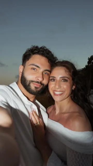 Samantha and her husband Marce taking a selfie at sunset
