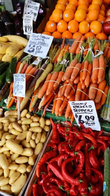 Colorful carrots and peppers at a farmers market